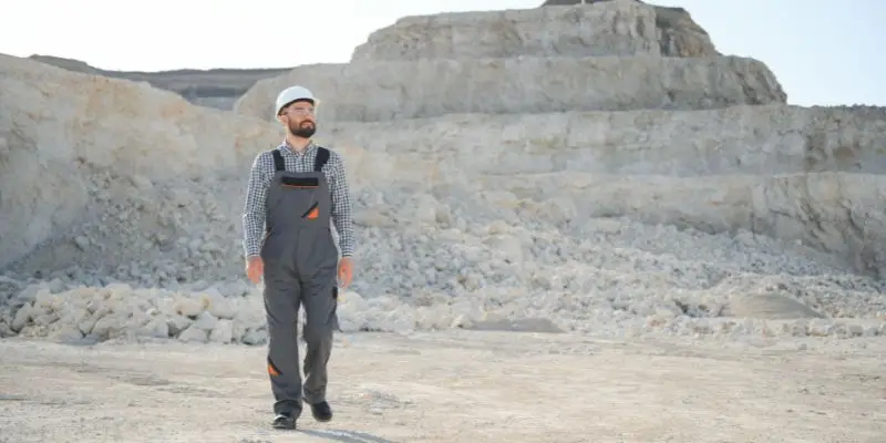 A miner walks at a rock quarry