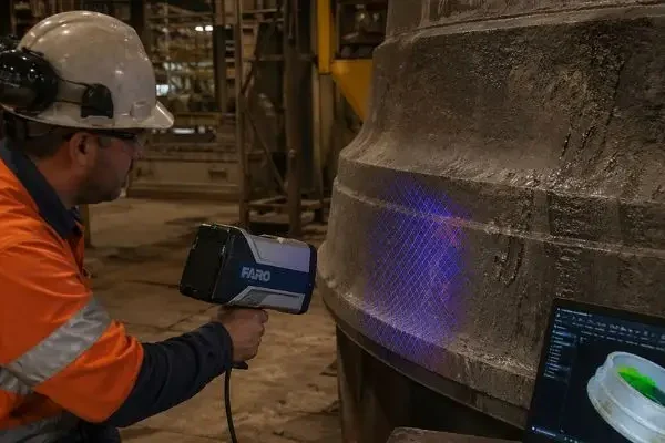Mantles and Bowl Liners Technician scanning cone crusher mantle and bowl liner with 3D scanner for wear analysis in plant