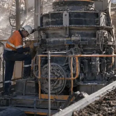 full machine crusher engineering support Technician performing maintenance with full machine crusher engineering support on cone crusher at mining site